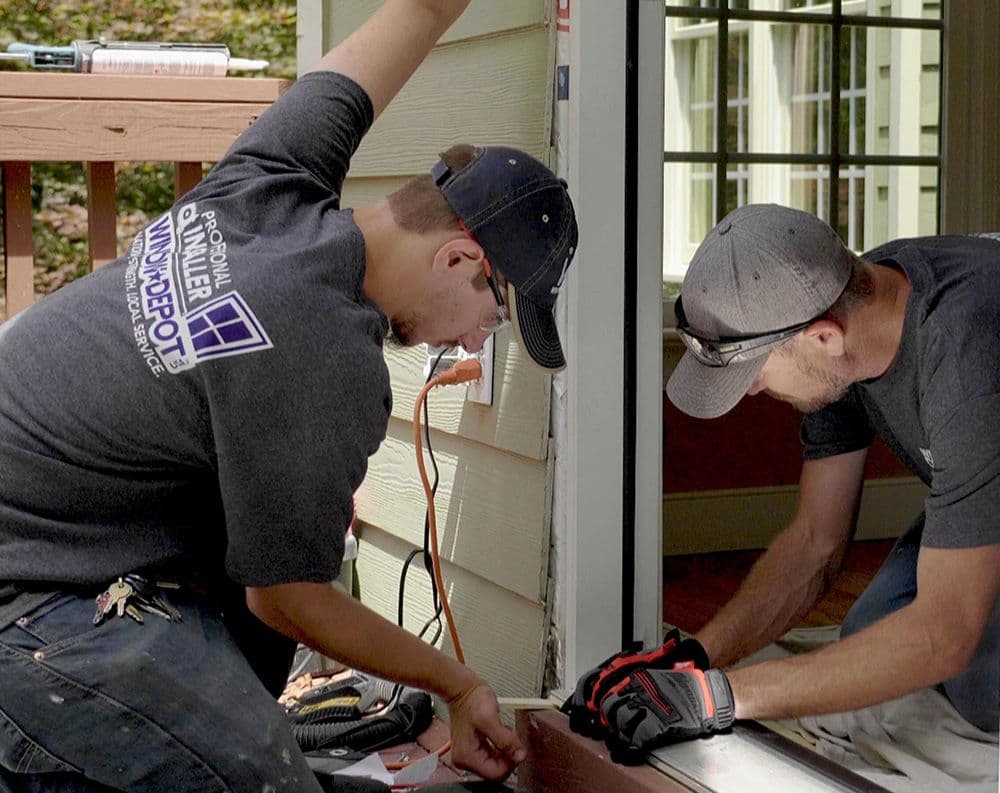 Workers Installing a Door