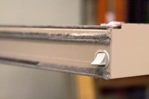 Closeup of Fuzzy Weatherstripping on Vinyl Window
